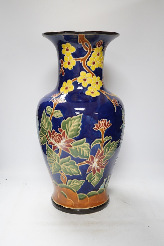A South East Asian polychrome pottery vase and a Staffordshire pottery greyhound pen holder, vase 53cm high. Condition - vase fair, pen holder marks to glazing